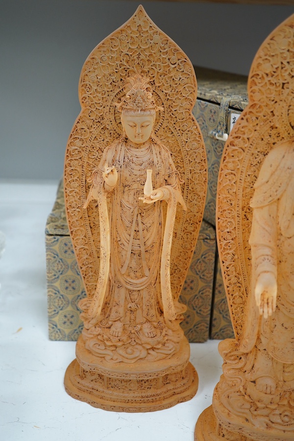 A set of three large Chinese glass figures of Bodhisattva, rust finish, with cases, 42cm high. Condition - good